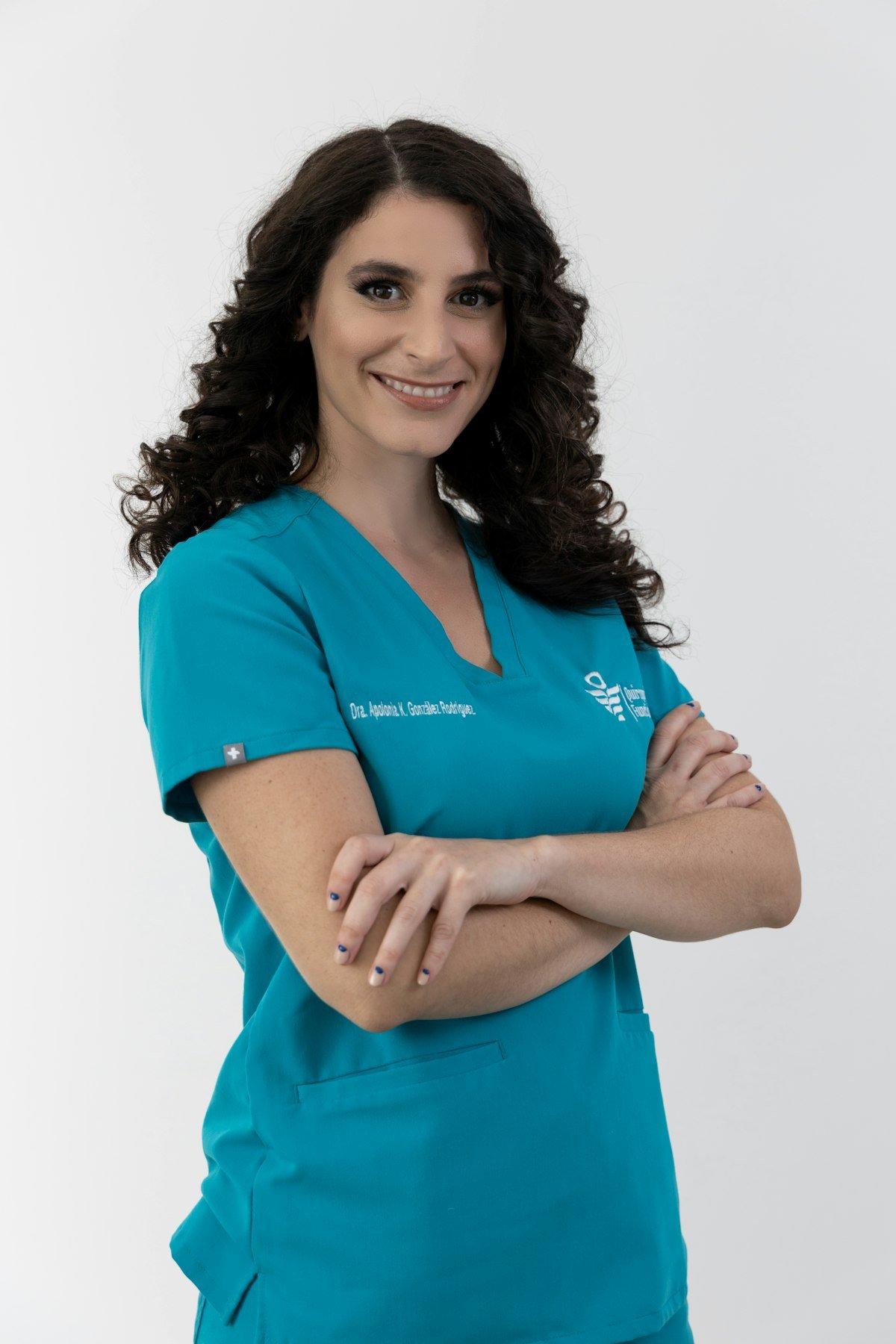 Certified nursing assistant in teal scrubs ready for a home care shift