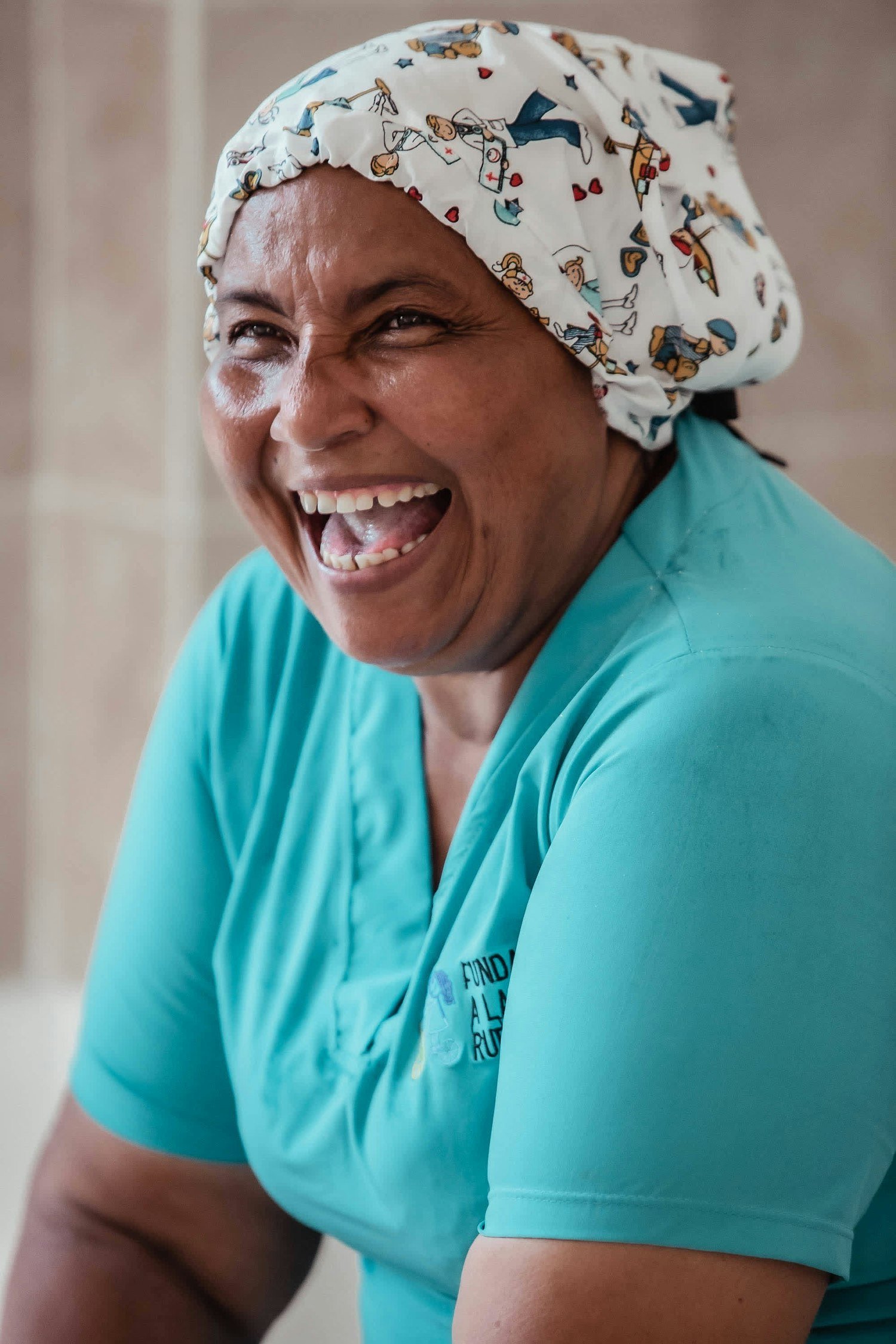 Smiling home care aide during a shift with Embracing Home Care in Central Florida