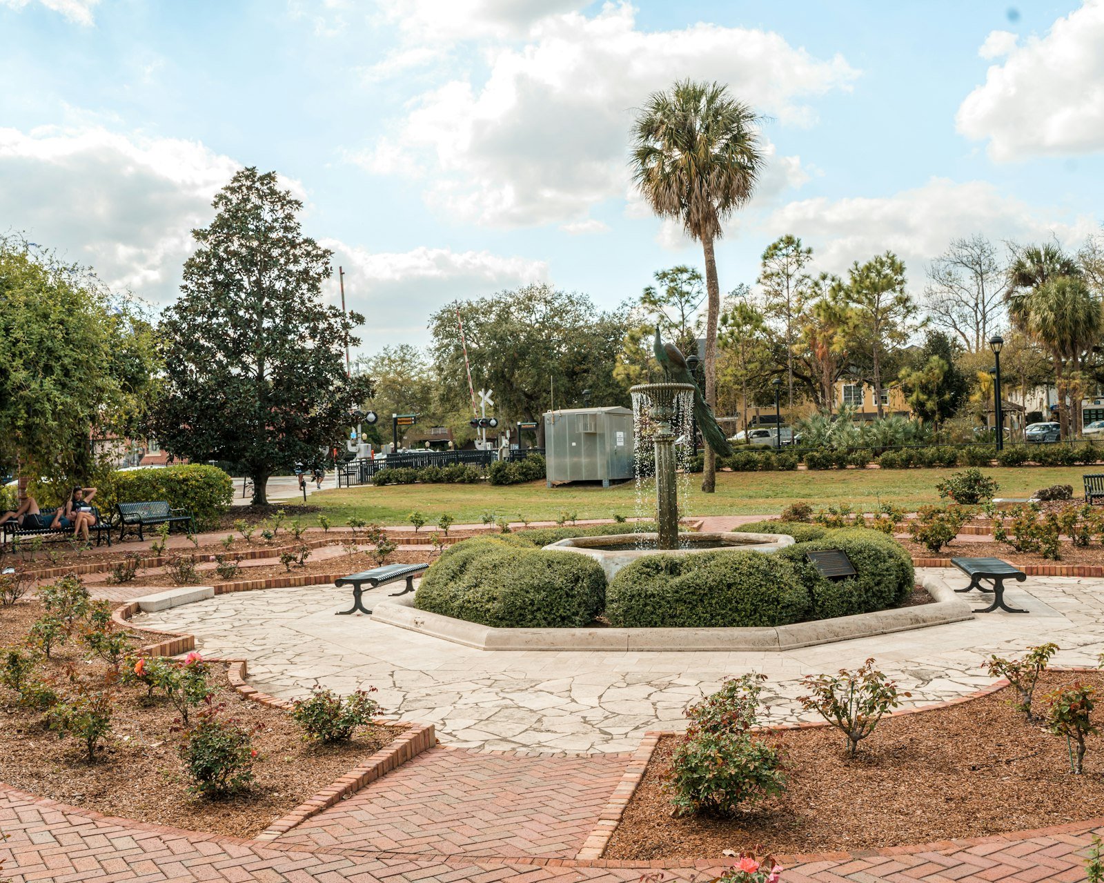 Shaded park with a fountain and palm trees in Winter Park, Florida